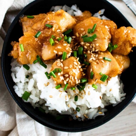 Bowl of teriyaki chicken over rice.
