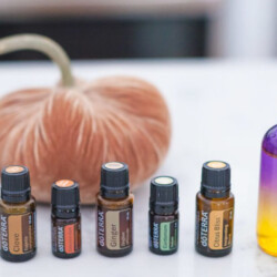 Containers of doTerra essential oils and a jar that reads "Pumpkin Spice Spray."