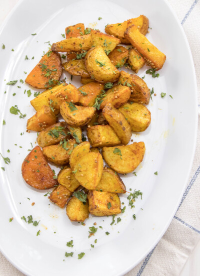 Serving tray of Bombay potatoes.