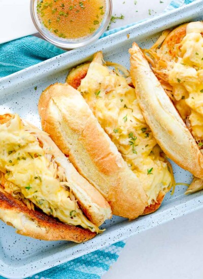 Tray of chicken French dip sandwiches.
