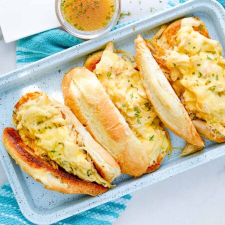 Tray of chicken French dip sandwiches.