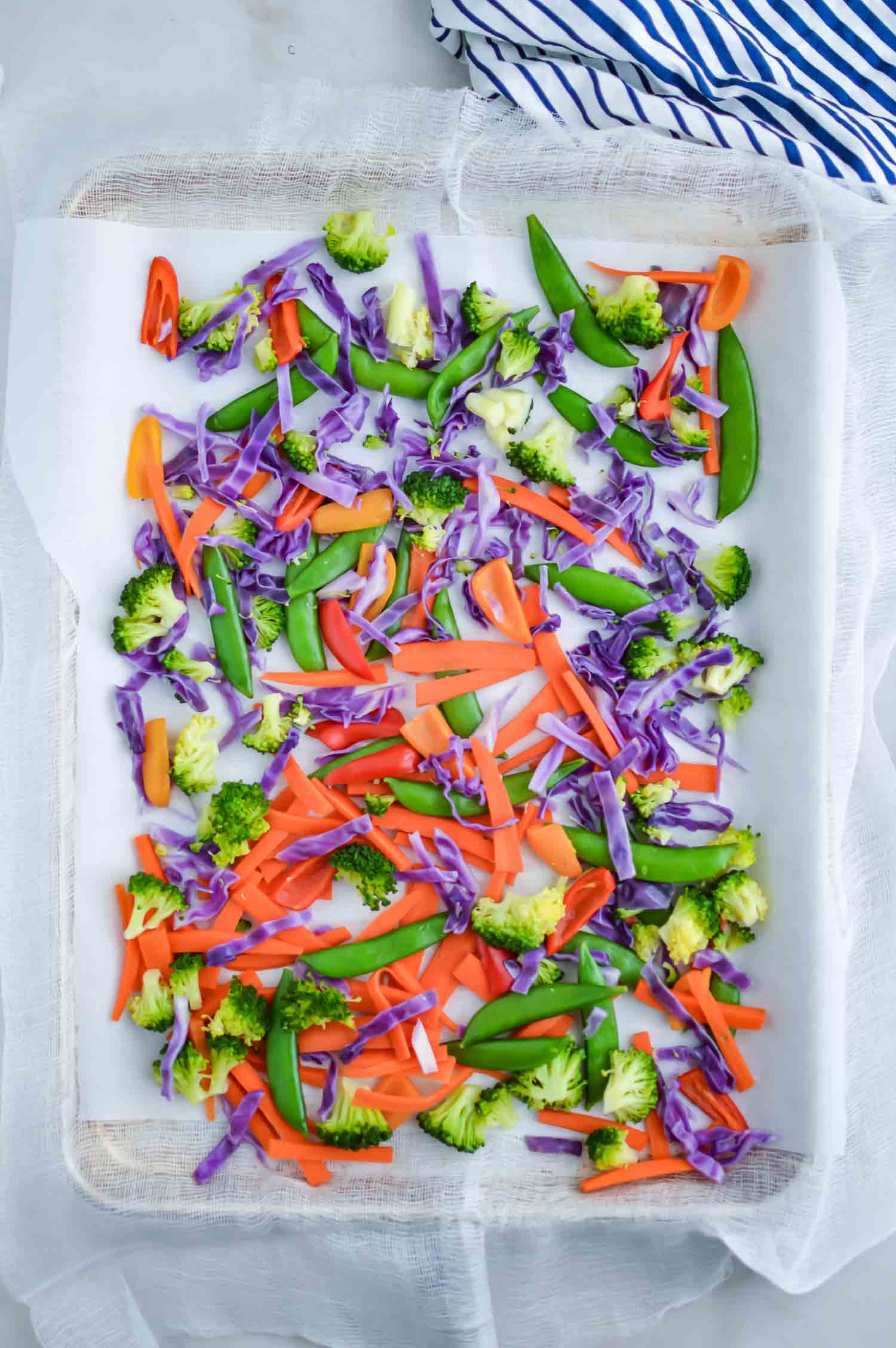 flash freezing vegetable for stir fry - veggies on cookie sheet with parchment