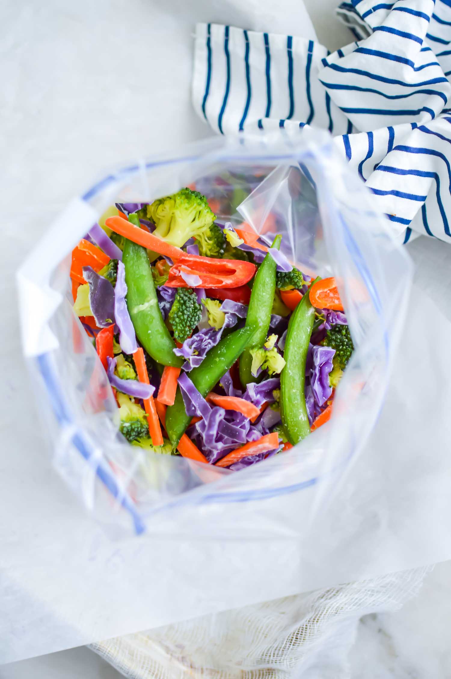 gallon freezer bag with frozen vegetables open at the top