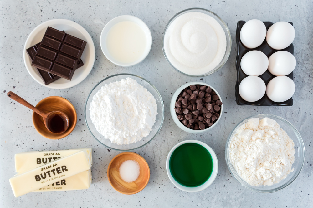 The ingredients in cups for creme de menthe brownies.