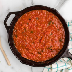 Skillet of pizza sauce.