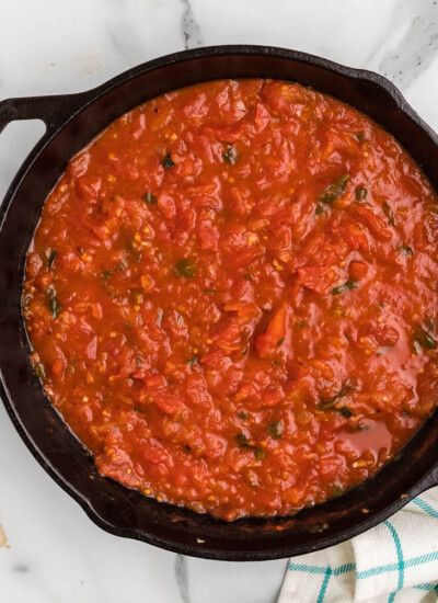 Skillet of pizza sauce.