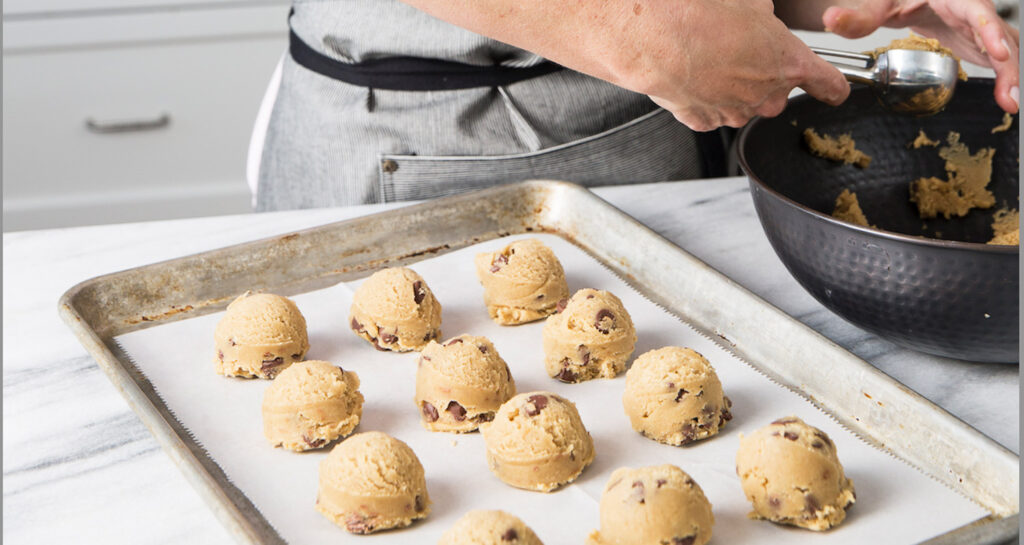 baking pan with cookie dough balls on it