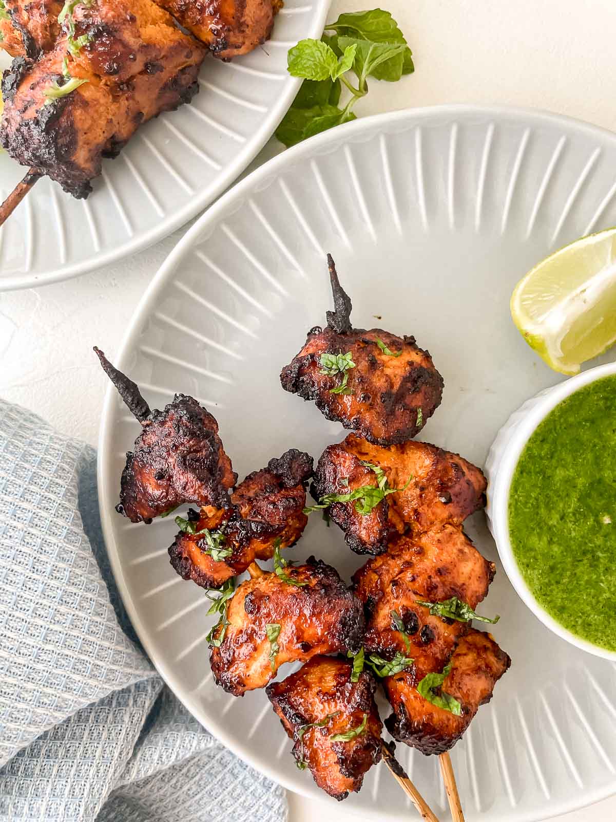 tandoori chicken kebabs on a plate.