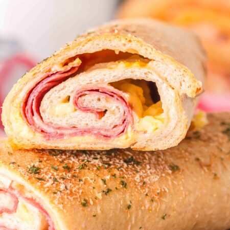 stromboli pizza stacked on each other on a table.