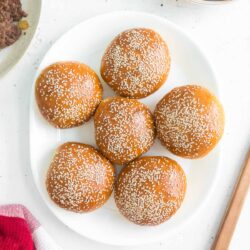 hamburger buns on a serving plate.