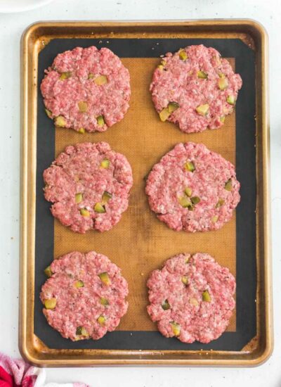 burger patties on abaking sheet.